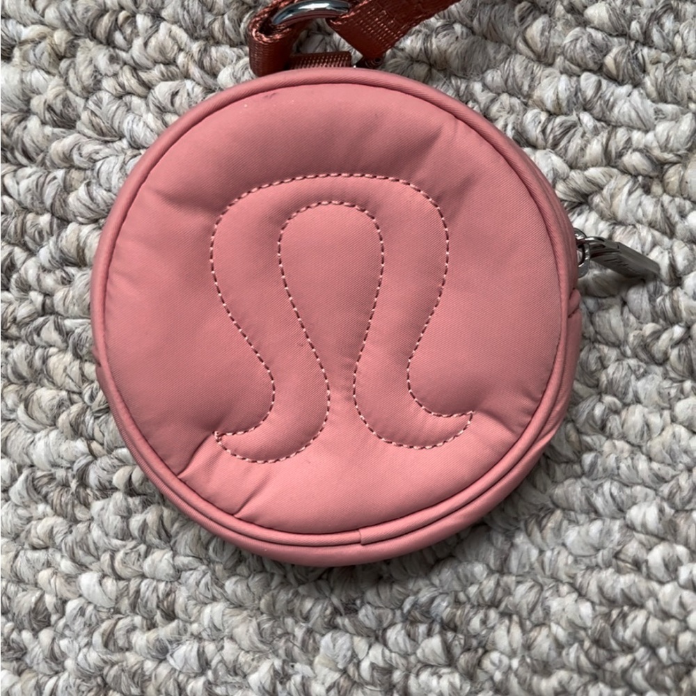 Lululemon logo coin pouch. I’m pretty sure it’s pink savannah